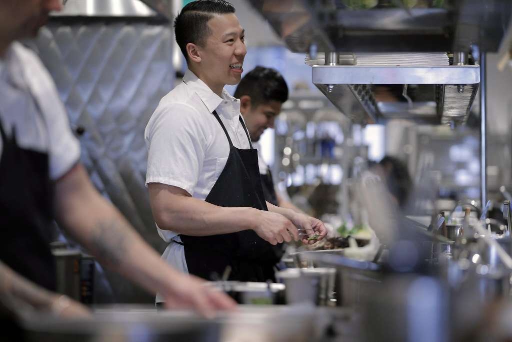 Chef prepares dinner at Chinatown restaurant